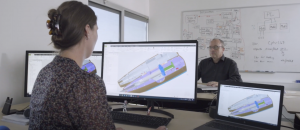 Woman and man with computer working on product development
