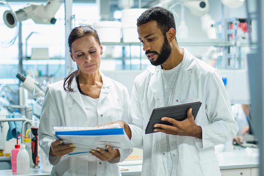 A close-up image of a scientist dressed for a clean room ensuring quality control of medical devices