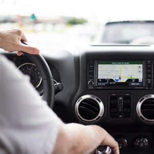 person driving car with navigation system