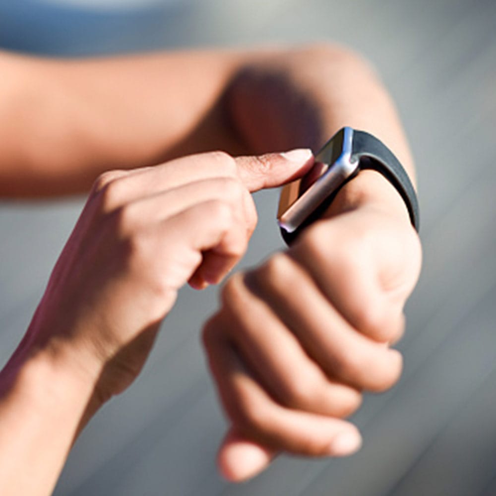 person touching smart watch