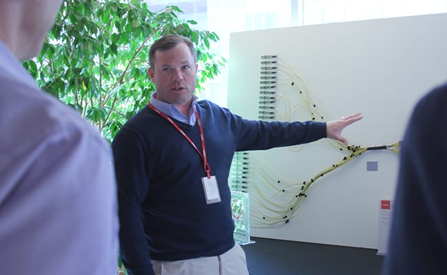 man pointing at white board