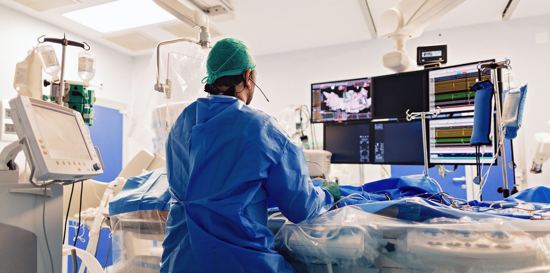Cardiologist doing catheter ablation with radiofrequency energy using medtech imaging system with fluoroscopic X-ray tube for electrophysiology interventional vascular procedures.