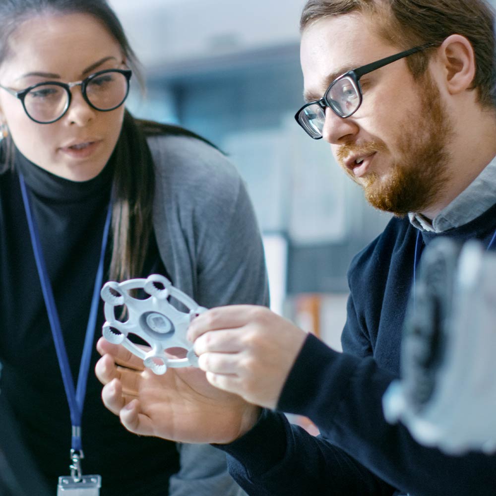 man and woman looking at object