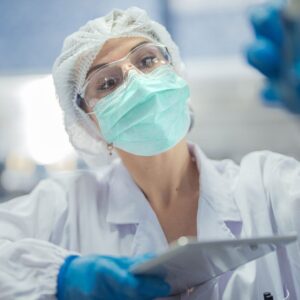 An image of a scientist working in a clean room lab.