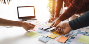 People at a table organizing study design.